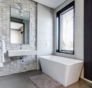 bathroom remodel with tile accent walls